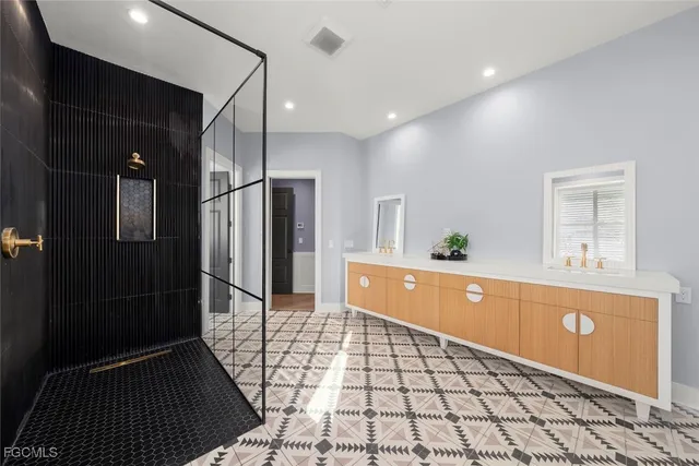 a view of a hallway with windows and stairs