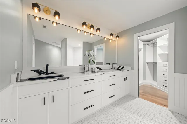 a bathroom with a tub shower and sink