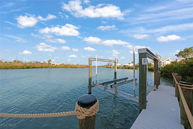 a view of a house with pool and a yard