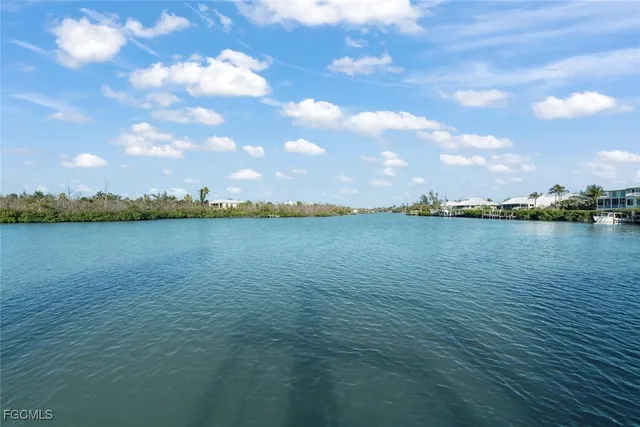 an aerial view of a house with a ocean view