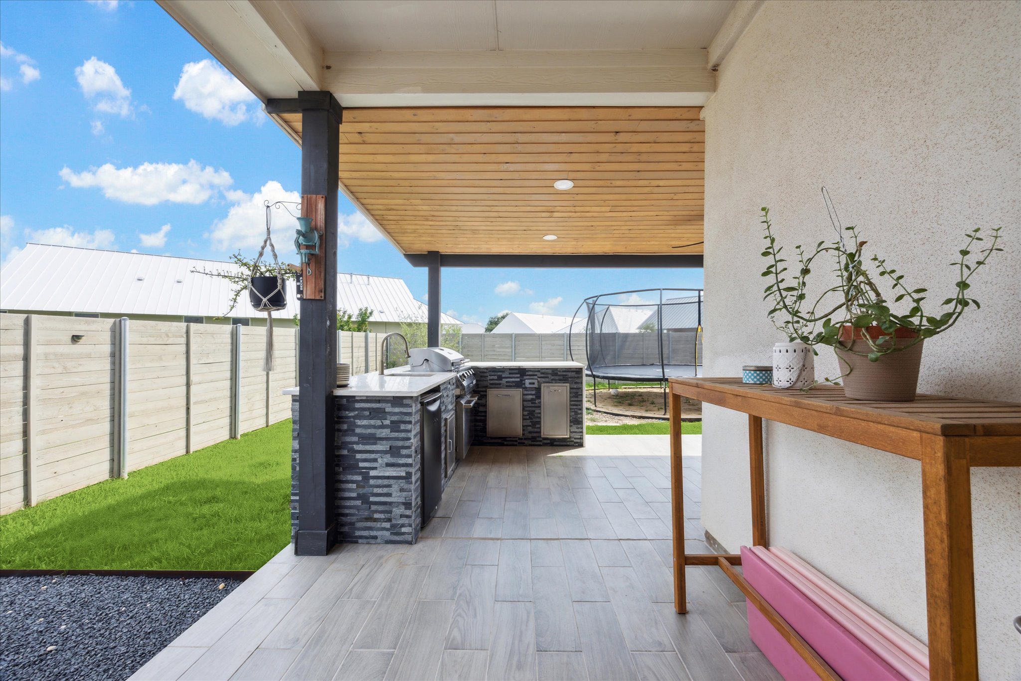 700 Legends Lane Georgetown, TX 78628 - Photo 25 of 31 Fenced backyard featuring a trampoline and a patio