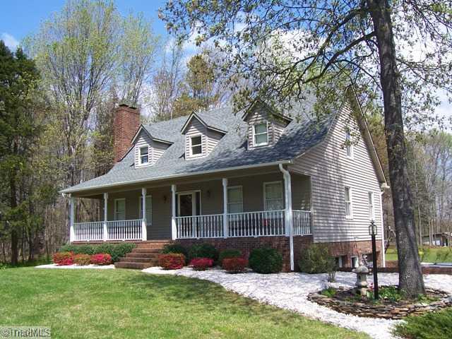 156 McDaniel Road Advance, NC 27006 - Photo 2 of 8 Exterior Front. Well manicured, landscaped lawn with flowering shrubs and plantings