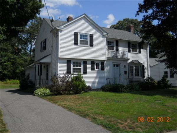 173 Abbott Street Springfield, MA 01118 - Photo 1 of 19 a front view of a house with a garden
