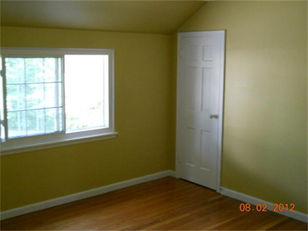 173 Abbott Street Springfield, MA 01118 - Photo 16 of 19 a view of a room with wooden floor and a window