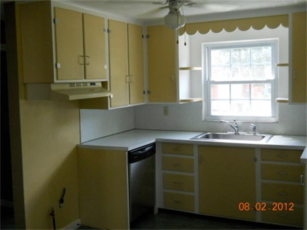 173 Abbott Street Springfield, MA 01118 - Photo 10 of 19 a kitchen with a sink a window and cabinets