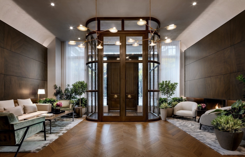 40 Trinity Place, Unit 1508 Boston, MA 02116 - Photo 4 of 30 a lobby with furniture and potted plants