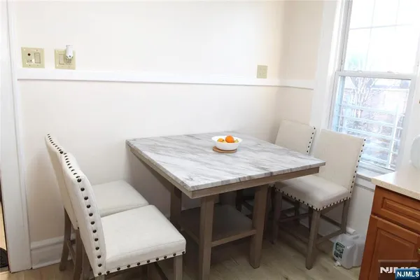 a view of a dining table and chairs in a room