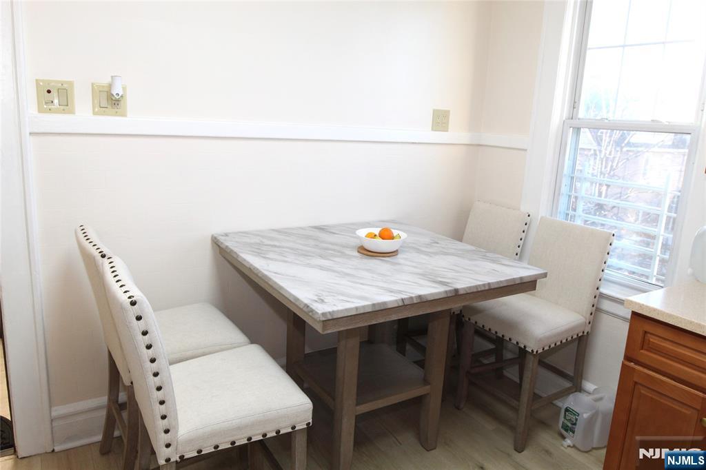 28 Rutland Avenue, Unit 3 Kearny, NJ 07032 - Photo 12 of 13 a view of a dining table and chairs in a room