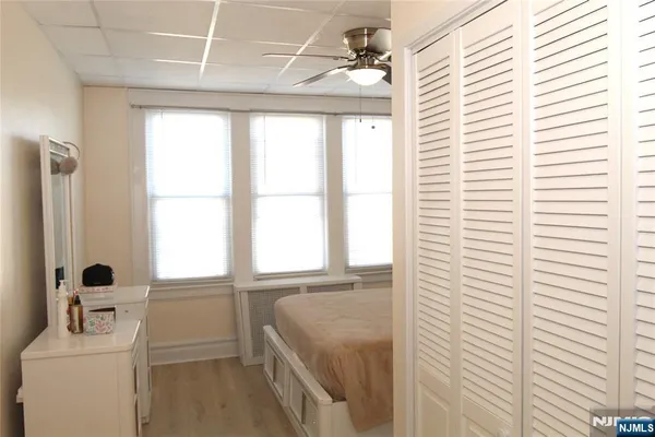 a bathroom with a sink a window and a mirror