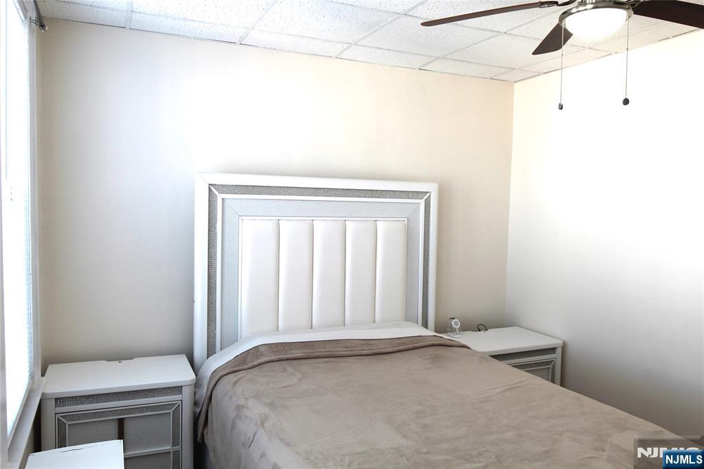 28 Rutland Avenue, Unit 3 Kearny, NJ 07032 - Photo 3 of 13 a bedroom with a bed and a window