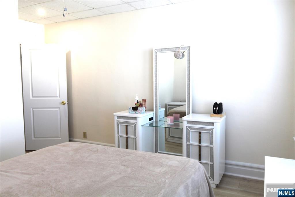 28 Rutland Avenue, Unit 3 Kearny, NJ 07032 - Photo 4 of 13 a room with a bed and a desk