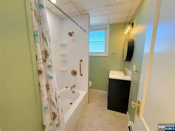 a bathroom with a bathtub and shower