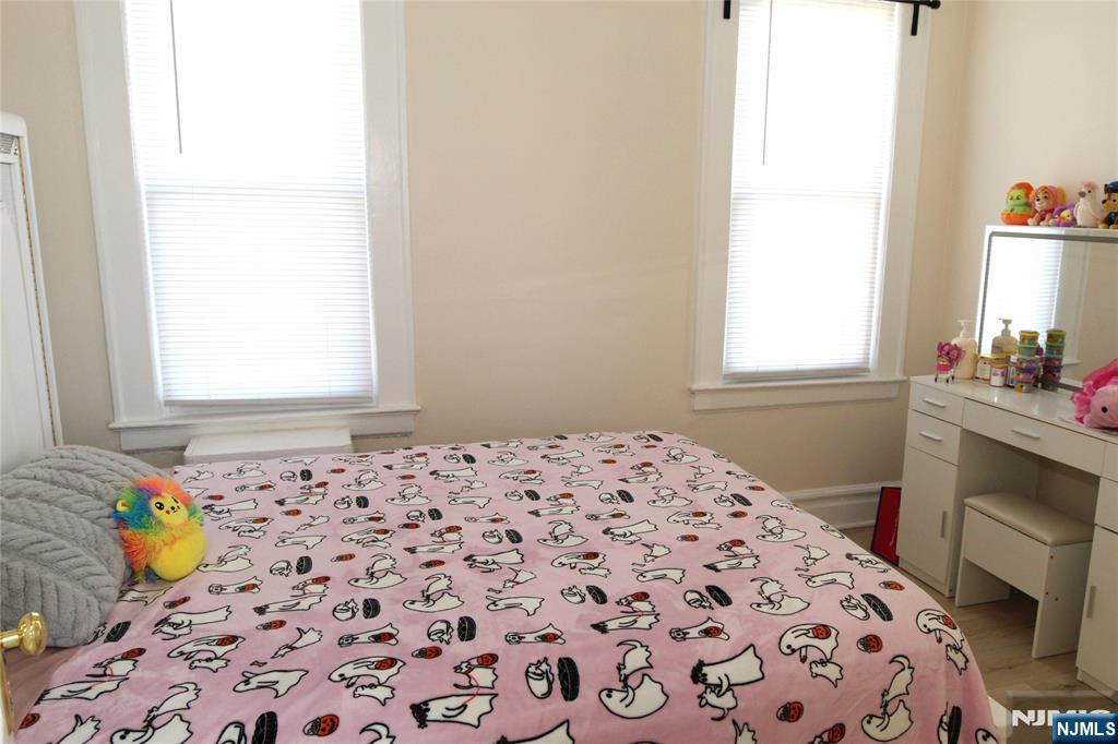 28 Rutland Avenue, Unit 3 Kearny, NJ 07032 - Photo 6 of 13 a bedroom with a bed and a window