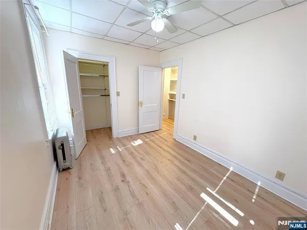 a view of livingroom with hardwood floor and hallway