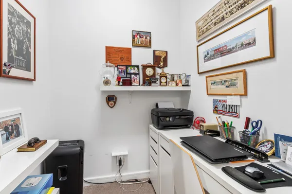 a room with furniture and clutter on the wall