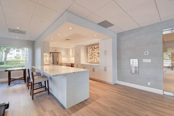 a view of a kitchen and dining room
