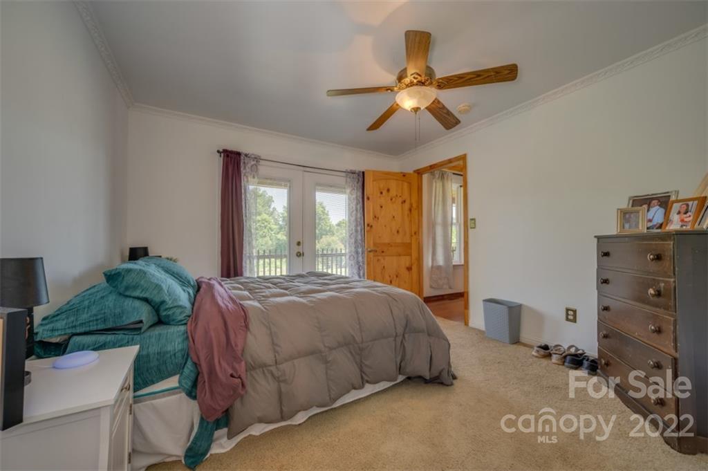 138 Robertson Creek Church Road Bostic, NC 28018 - Photo 16 of 31 a spacious bedroom with a bed and window