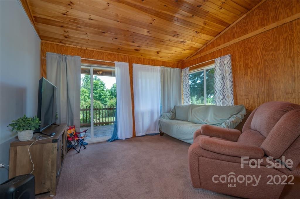 138 Robertson Creek Church Road Bostic, NC 28018 - Photo 17 of 31 a living room with furniture and a large window