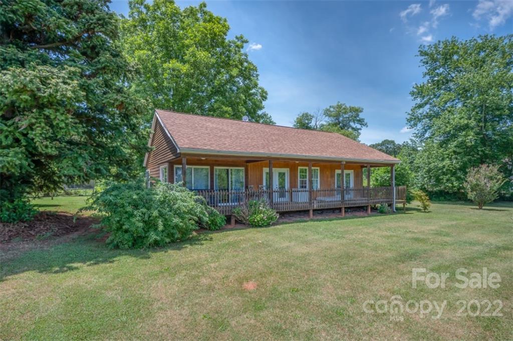 138 Robertson Creek Church Road Bostic, NC 28018 - Photo 2 of 31 a view of a house with a yard and sitting area
