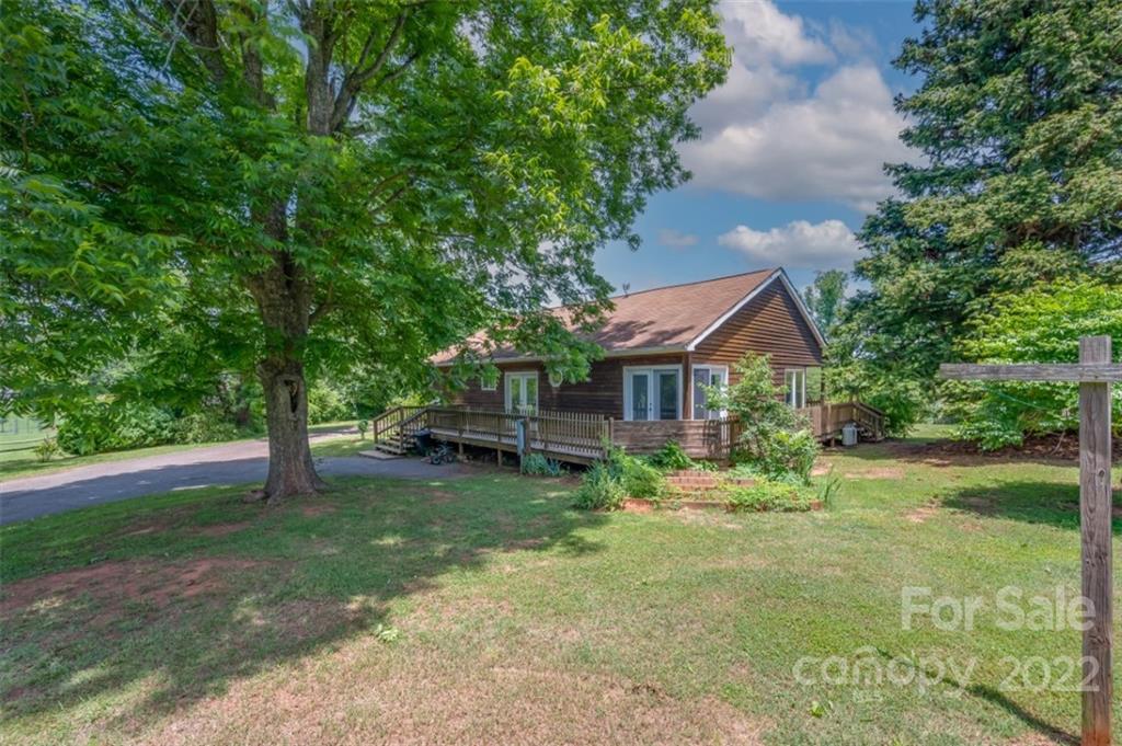 138 Robertson Creek Church Road Bostic, NC 28018 - Photo 28 of 31 a view of a house with a yard