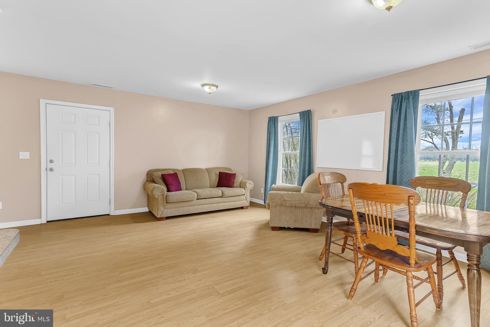 29827 Polks Road Princess Anne, MD 21853 - Photo 4 of 41 a living room with furniture and a large window