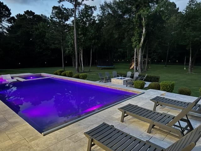 30702 Spring Lake Boulevard Tomball, TX 77375 - Photo 43 of 49 Pool lights change colors and notice the lights on the fencing