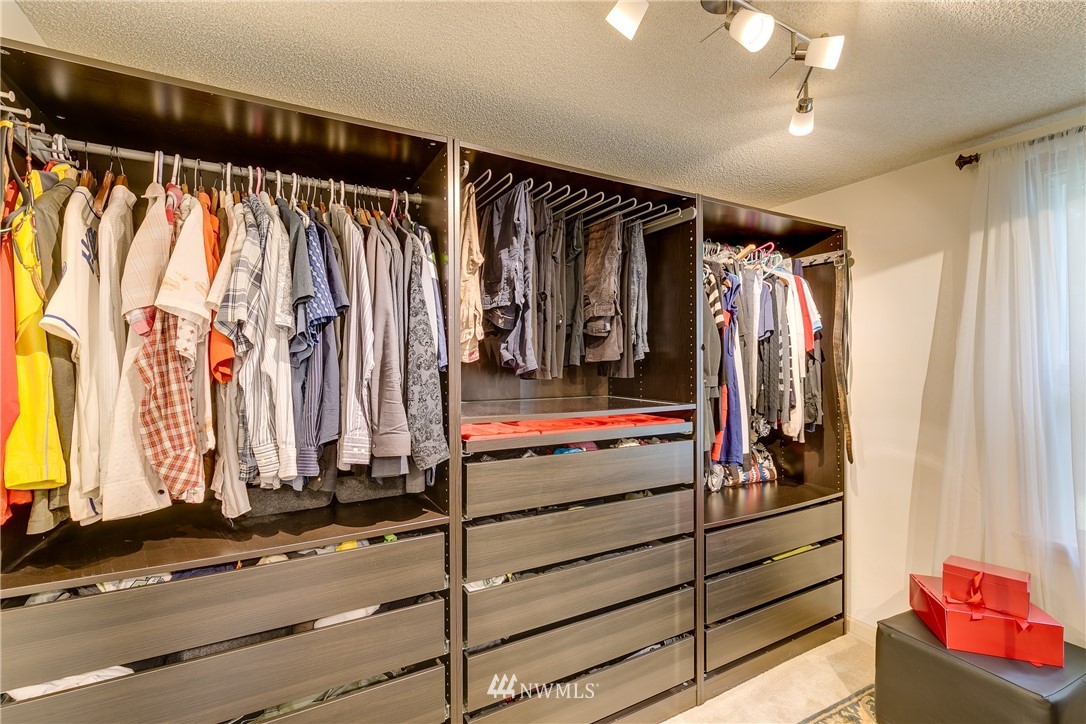 6745 18th Avenue Southwest Seattle, WA 98106 - Photo 14 of 24 a view of walk in closet with clothes and shoes