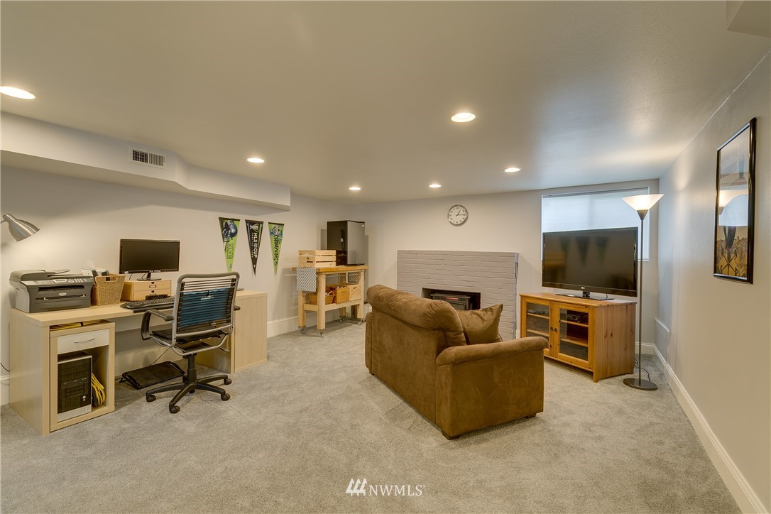 6745 18th Avenue Southwest Seattle, WA 98106 - Photo 15 of 24 a living room with furniture and a flat screen tv