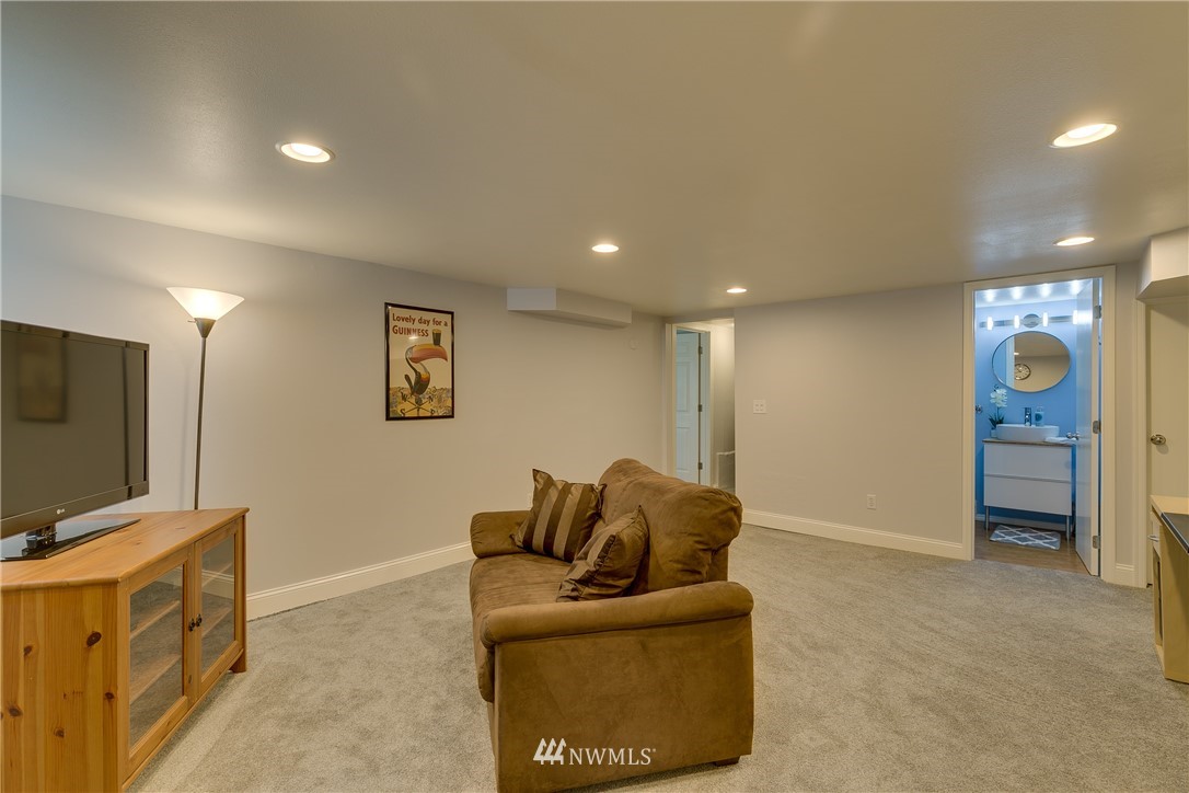 6745 18th Avenue Southwest Seattle, WA 98106 - Photo 16 of 24 a living room with furniture and a flat screen tv