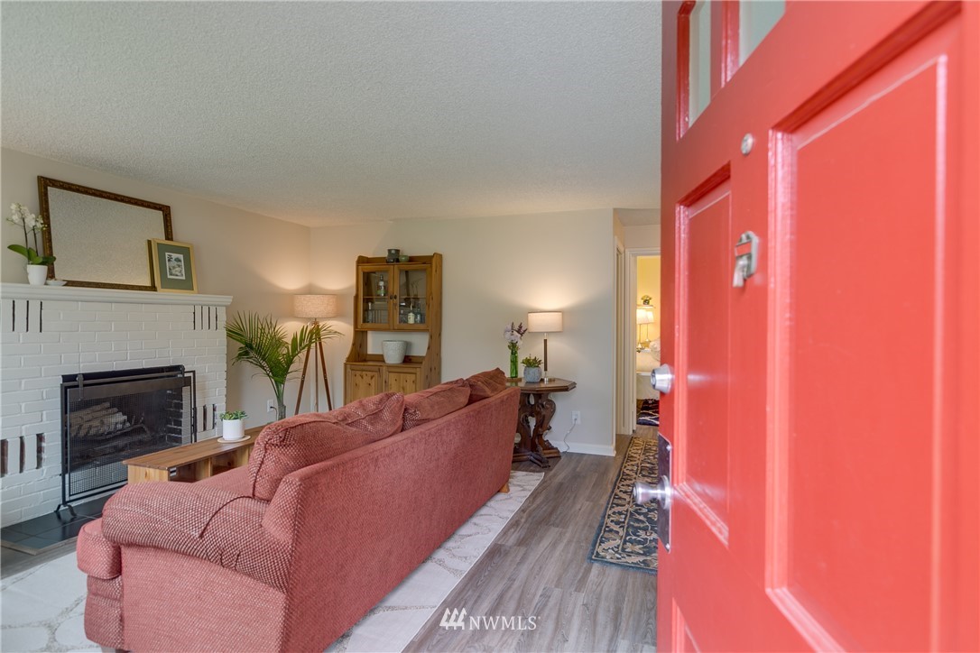 6745 18th Avenue Southwest Seattle, WA 98106 - Photo 3 of 24 a living room with furniture and a fireplace