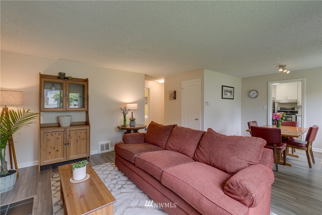 6745 18th Avenue Southwest Seattle, WA 98106 - Photo 5 of 24 a living room with furniture and wooden floor