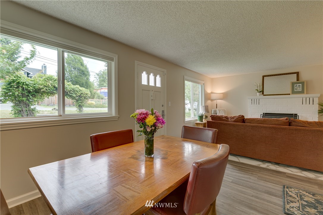6745 18th Avenue Southwest Seattle, WA 98106 - Photo 7 of 24 a view of kitchen and dining room with wooden floor
