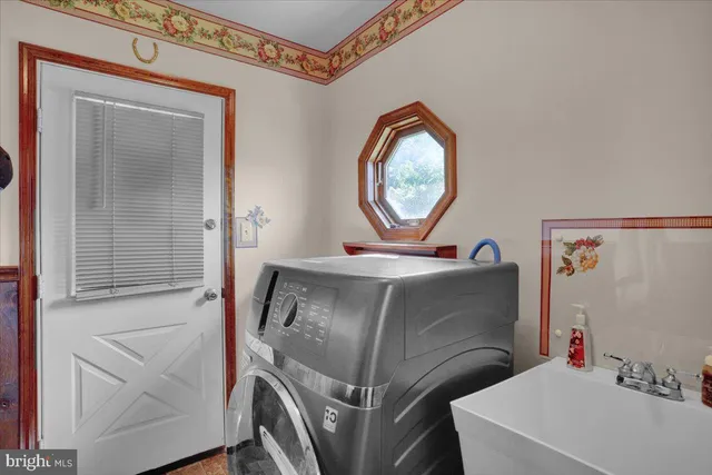 a bedroom with a bed and a lamp