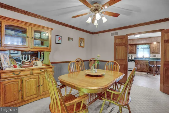 a dining room with furniture and window