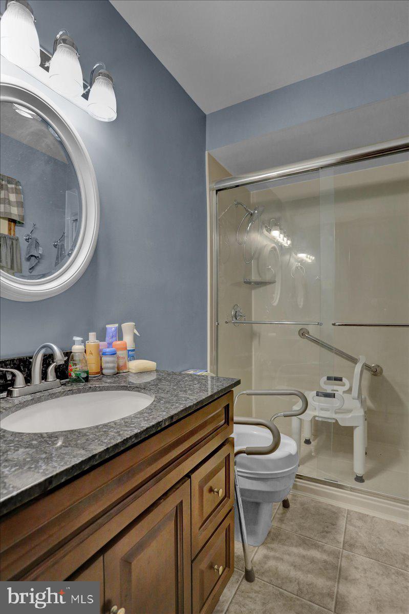 90 Preston Road Wernersville, PA 19565 - Photo 35 of 45 a bathroom with a granite countertop toilet sink and mirror