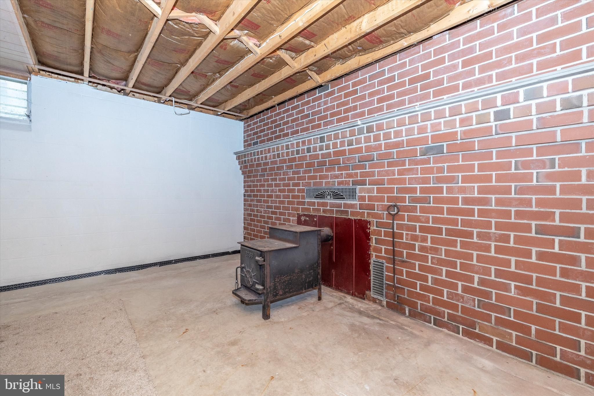 26 George Street Taneytown, MD 21787 - Photo 33 of 61 Basement with wood stove