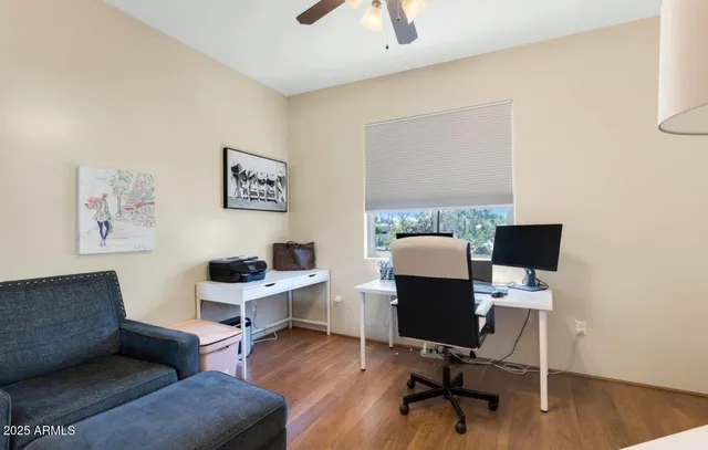 a workspace with furniture and wooden floor