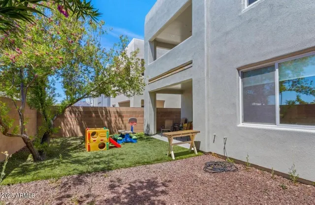 a backyard of a house with seating space