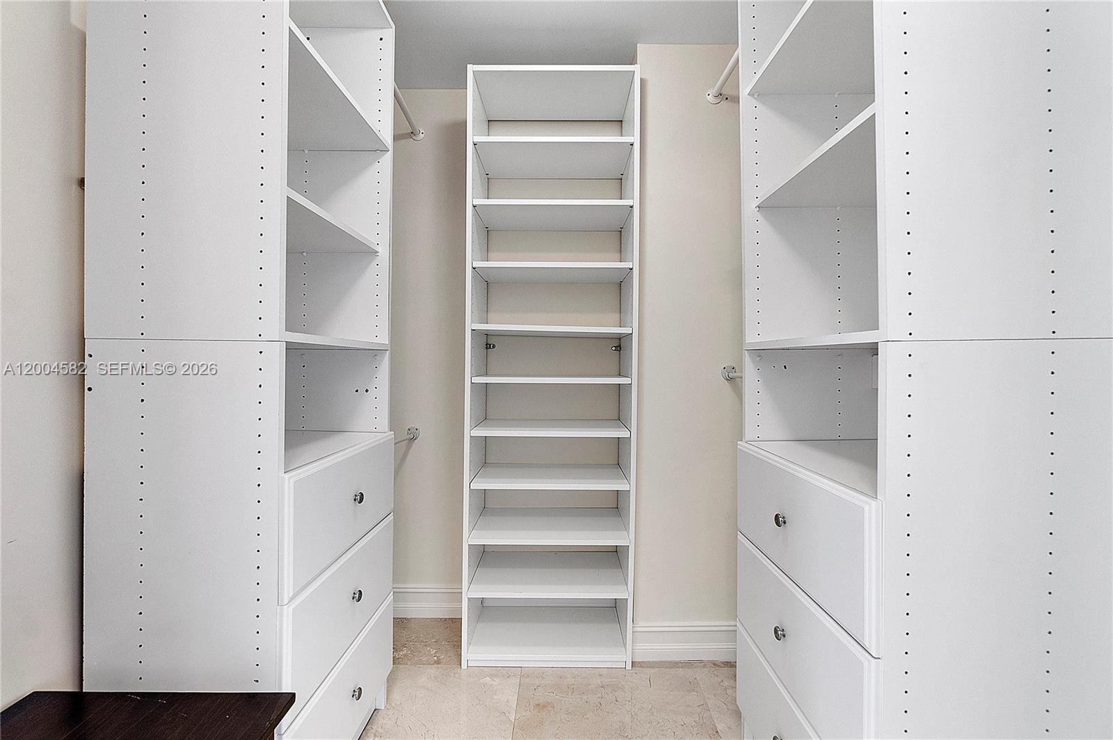 3350 Southwest 27th Avenue, Unit 1803 Miami, FL 33133 - Photo 14 of 22 a view of walk in closet with empty racks