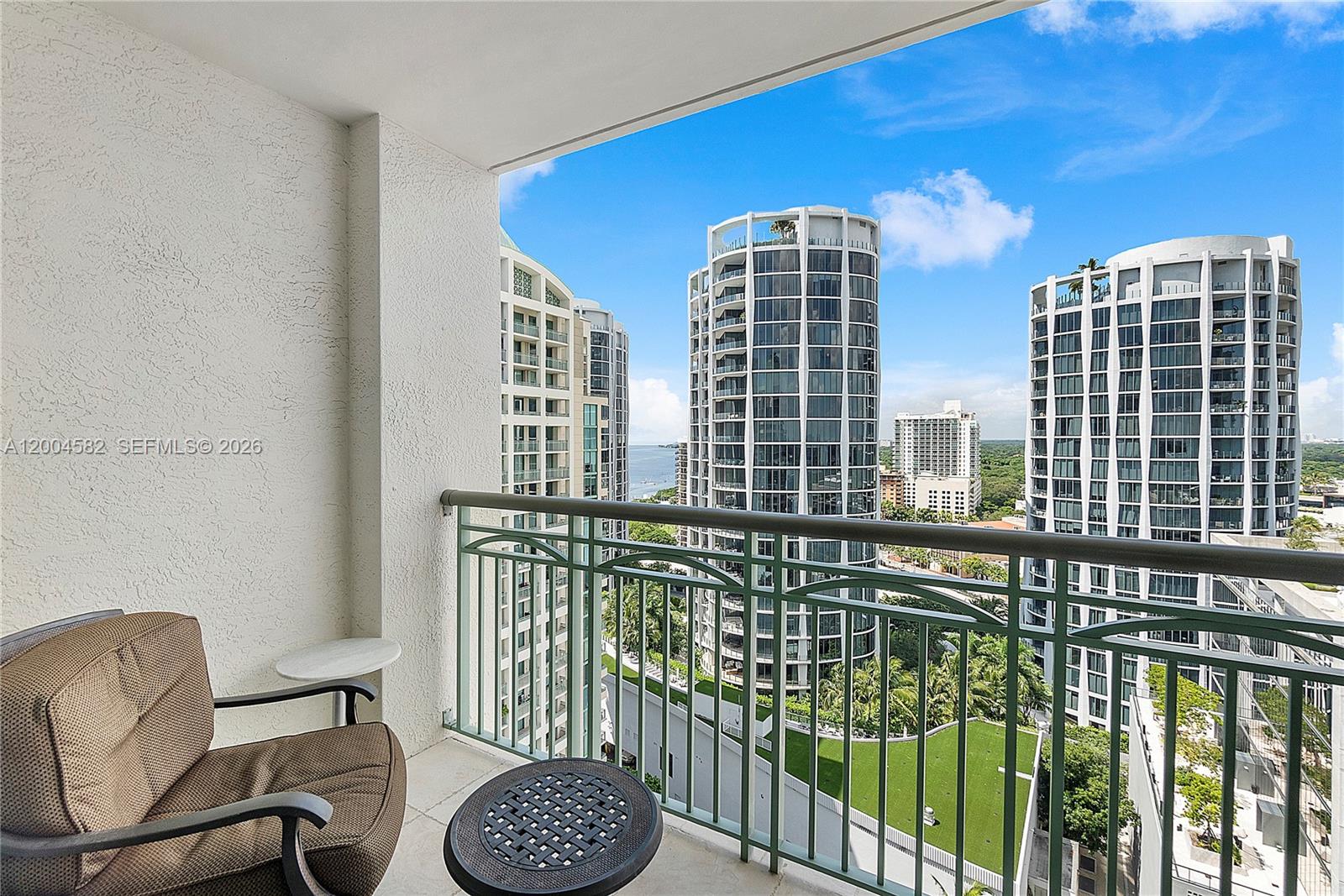 3350 Southwest 27th Avenue, Unit 1803 Miami, FL 33133 - Photo 18 of 22 a balcony with chairs and table
