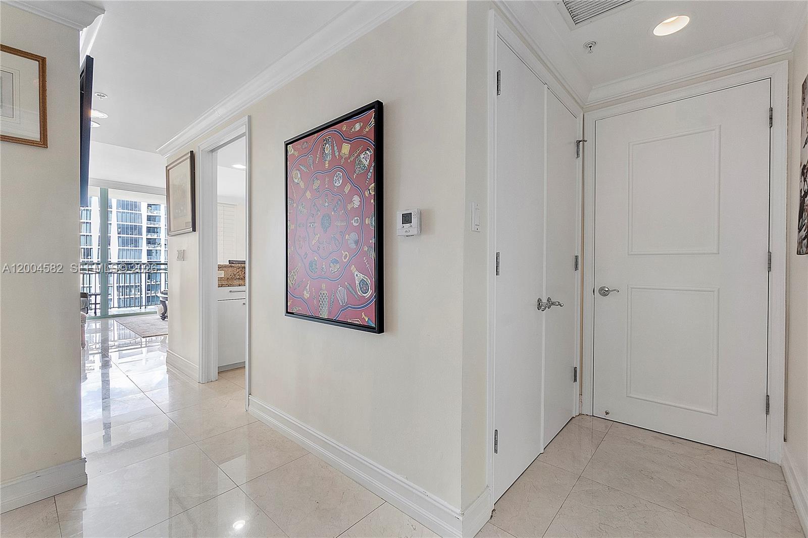 3350 Southwest 27th Avenue, Unit 1803 Miami, FL 33133 - Photo 7 of 22 a view of an empty room with windows