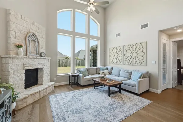 a living room with furniture and a fireplace