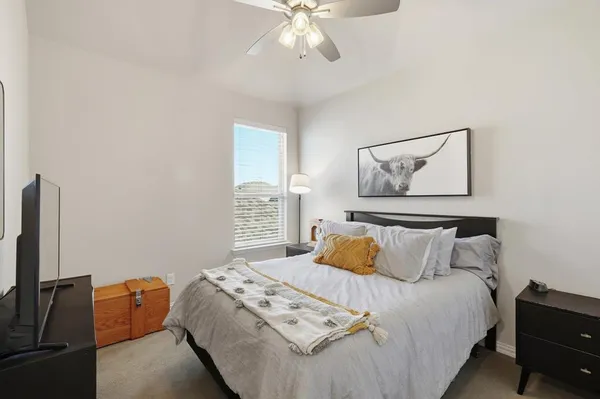 a bedroom with a bed and dresser