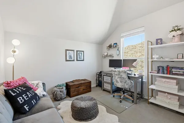 a view of a livingroom with workspace and a couch