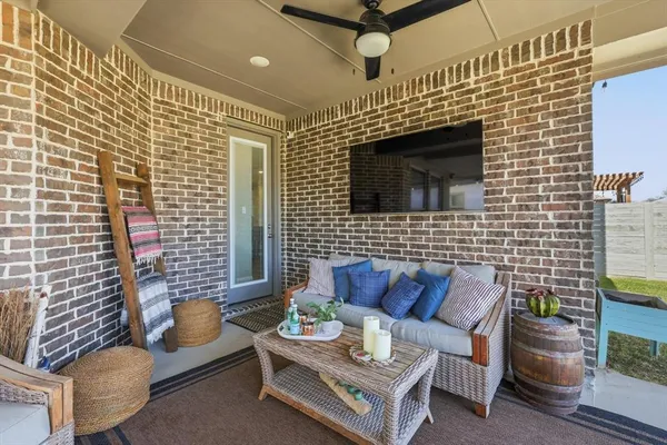 a outdoor living space with furniture and a fireplace