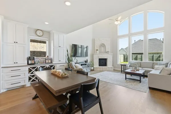 a living room with furniture wooden floor and a fireplace
