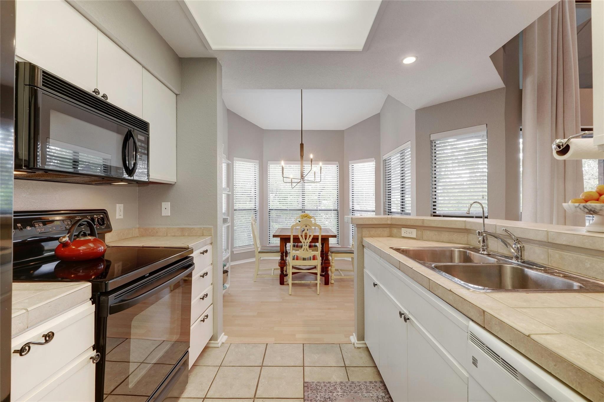 4711 Spicewood Springs Road, Unit 1201 Austin, TX 78759 - Photo 11 of 35 Kitchen opens nicely to the adjacent dining area