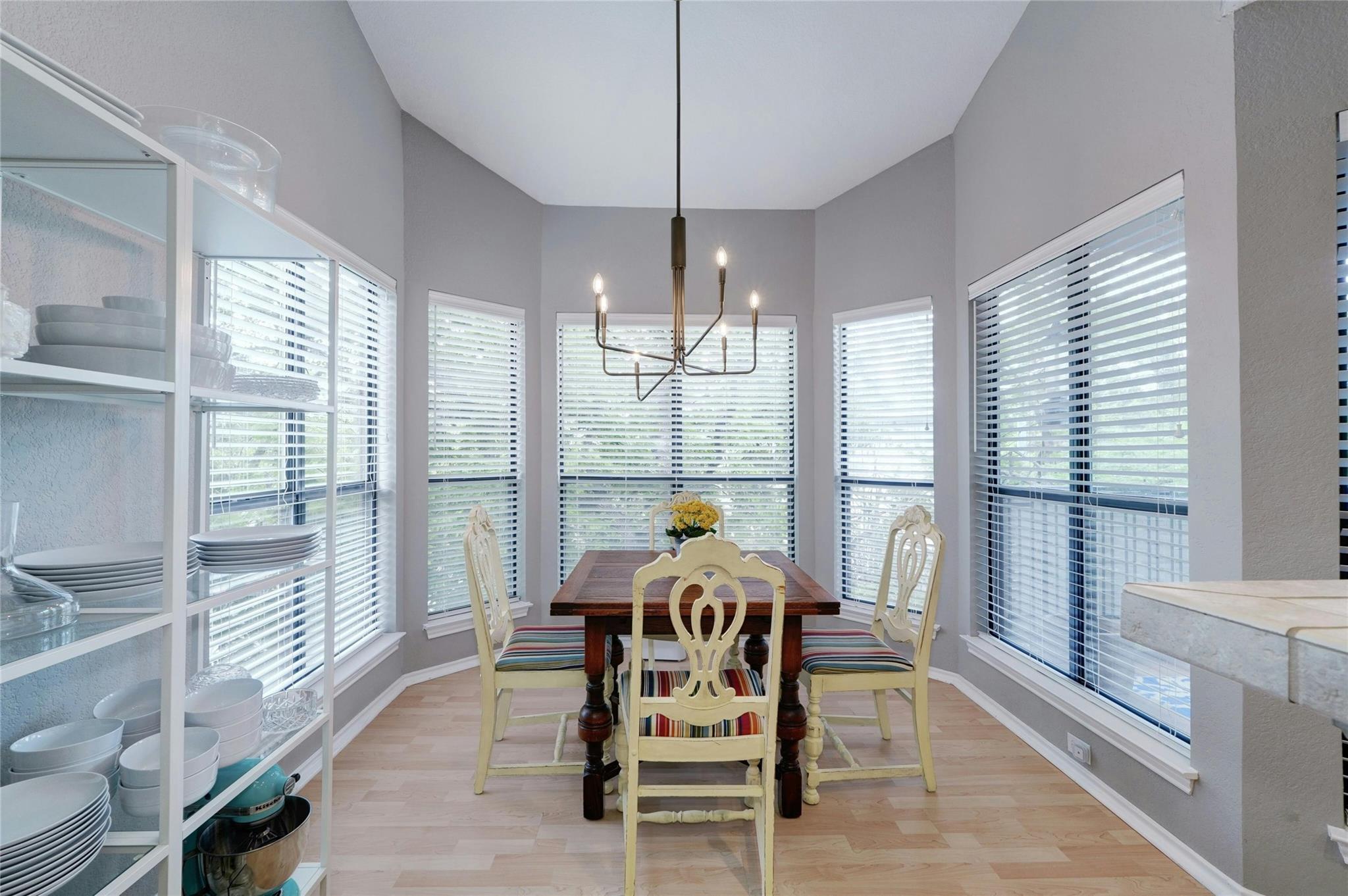 4711 Spicewood Springs Road, Unit 1201 Austin, TX 78759 - Photo 12 of 35 Bright dining space framed by surrounding windowsnatural light