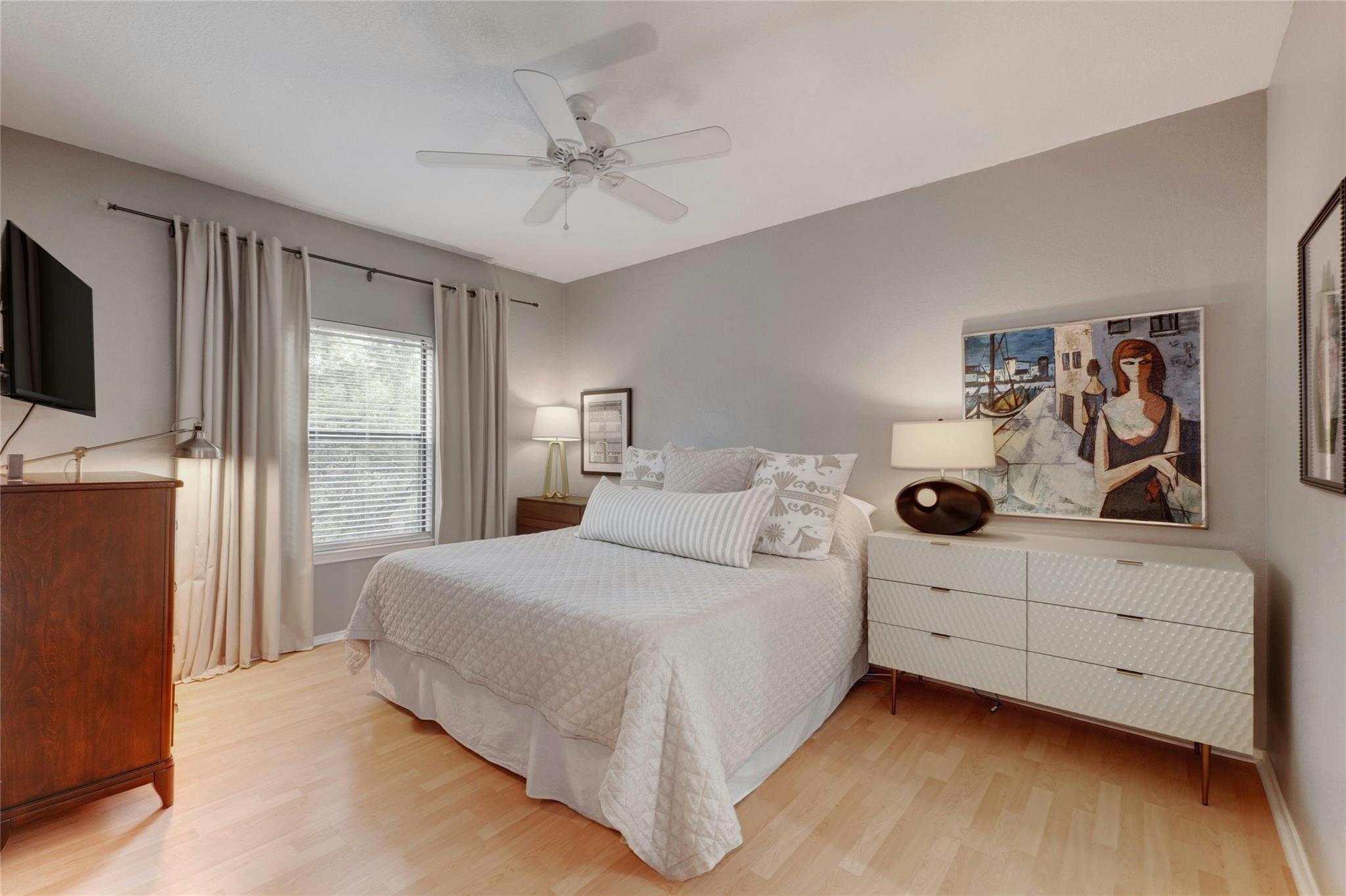 4711 Spicewood Springs Road, Unit 1201 Austin, TX 78759 - Photo 16 of 35 Spacious primary bedroom with a calm, comfortable feel