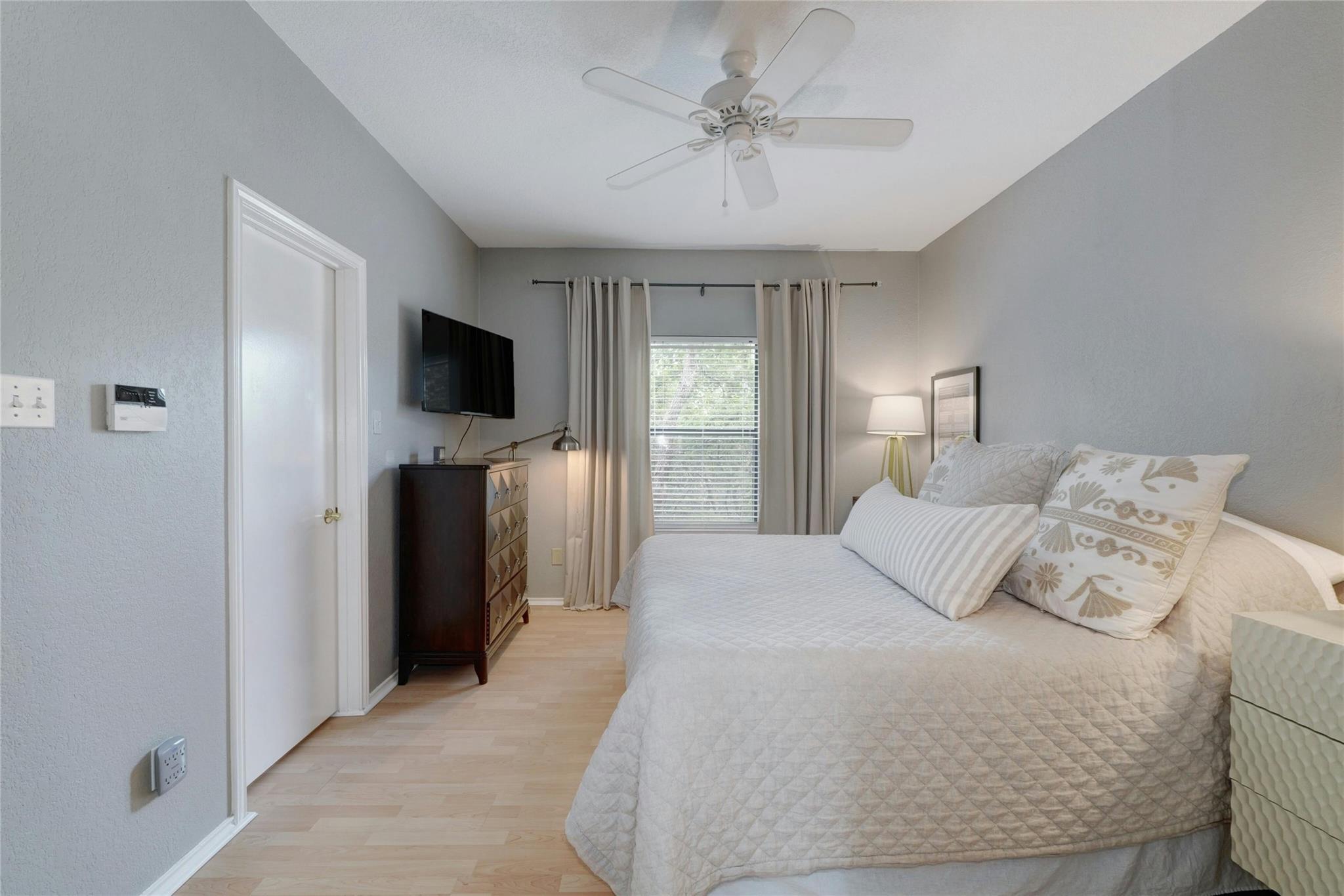 4711 Spicewood Springs Road, Unit 1201 Austin, TX 78759 - Photo 17 of 35 Primary bedroom with generous space and soft neutral tones